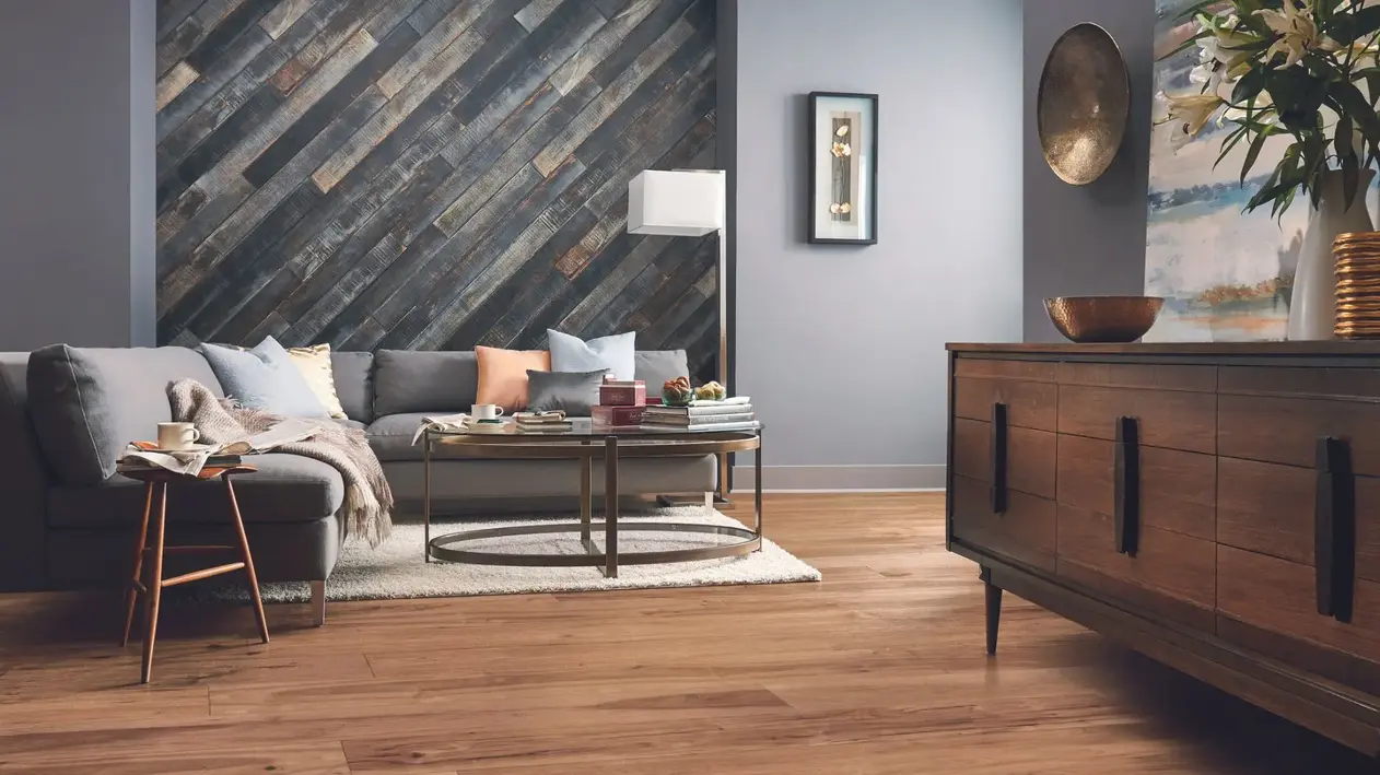 Living room with grey furniture and brown hardwood floors